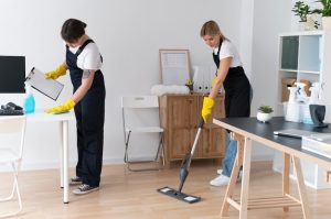 Office cleaning team caring for a workspace